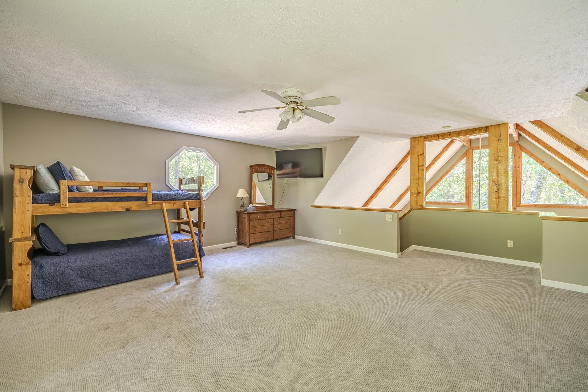 435 Murray Lane Counce, TN 38326 - Photo 28 of 34 Spacious room featuring vaulted ceilings, a ceiling fan, and light-toned carpet flooring
