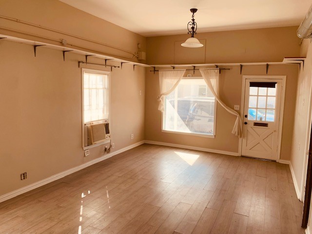 401 East Main Street Humble, TX 77338 - Photo 25 of 36 a view of an empty room with wooden floor and a window