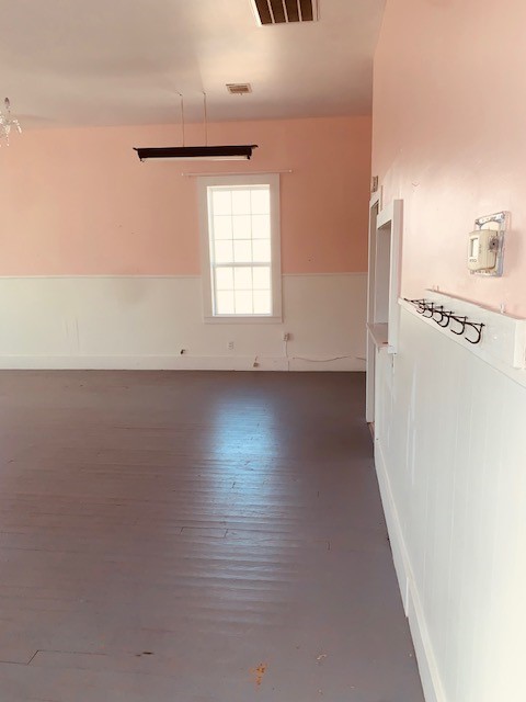 401 East Main Street Humble, TX 77338 - Photo 33 of 36 an empty room with wooden floor and windows