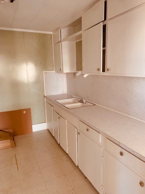 401 East Main Street Humble, TX 77338 - Photo 34 of 36 a bathroom with a sink and a mirror
