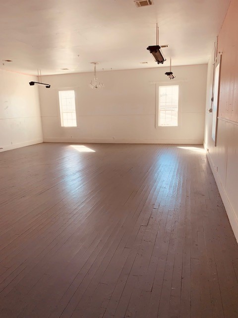 401 East Main Street Humble, TX 77338 - Photo 36 of 36 an empty room with wooden floor and windows