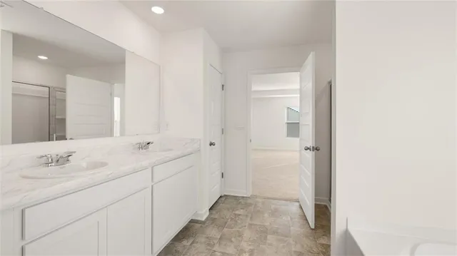 a white bath tub sitting in a bathroom