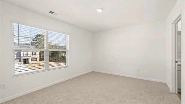 a bathroom with a bathtub shower sink and a toilet