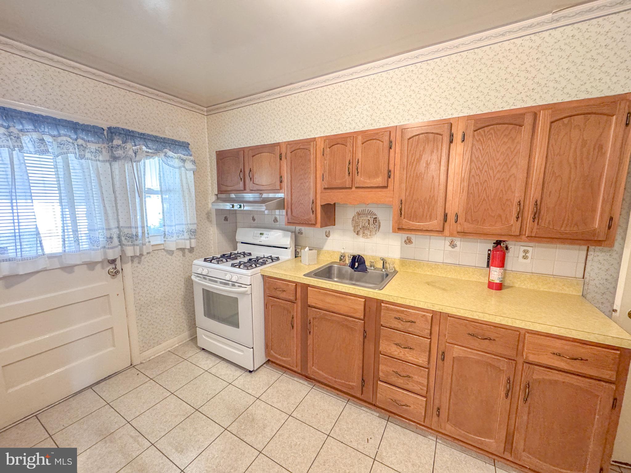 1948 Wareham Road Baltimore, MD 21222 - Photo 11 of 26 a room with a bed and a cabinets