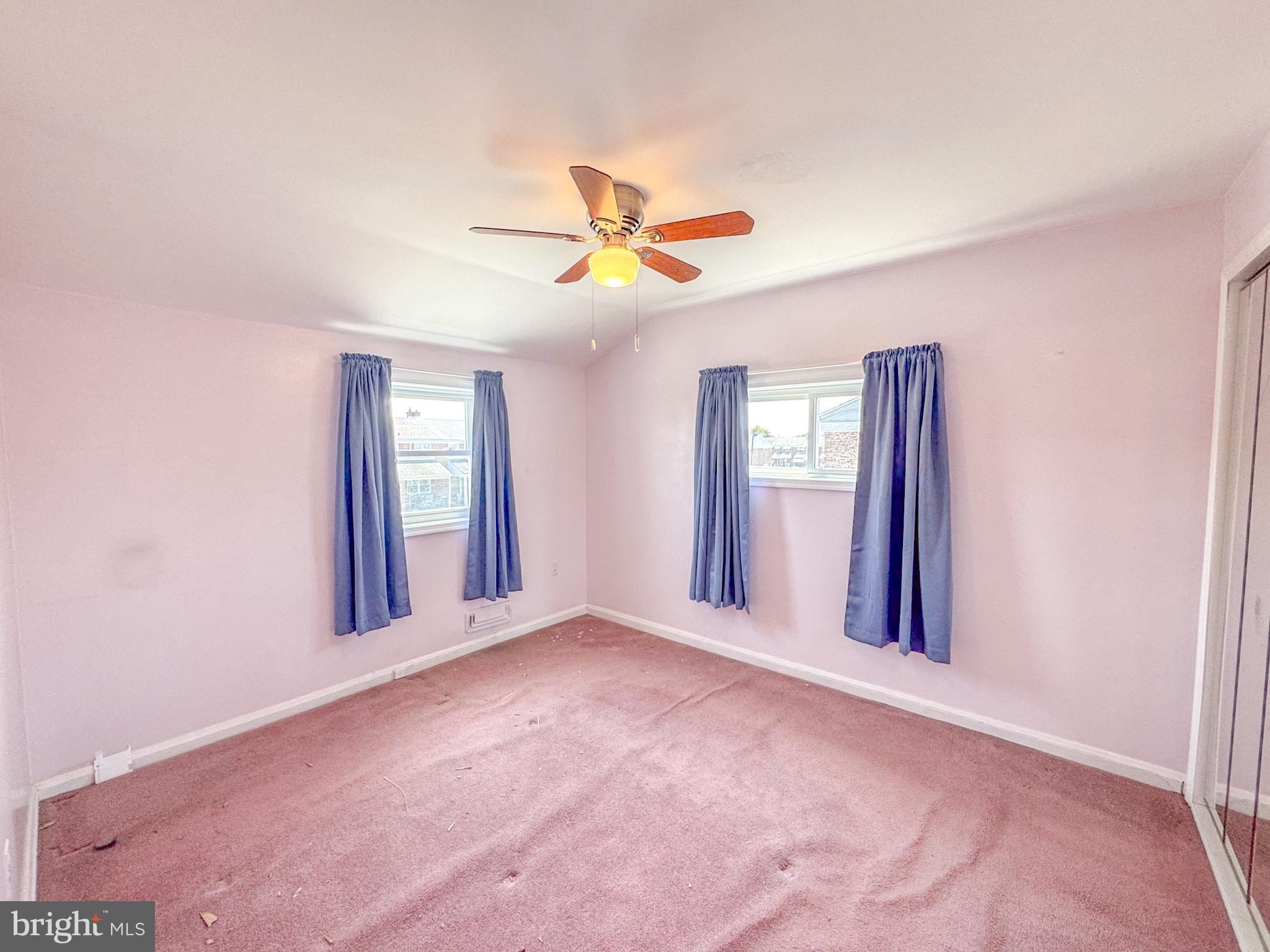 1948 Wareham Road Baltimore, MD 21222 - Photo 14 of 26 a view of a livingroom with a ceiling fan and window