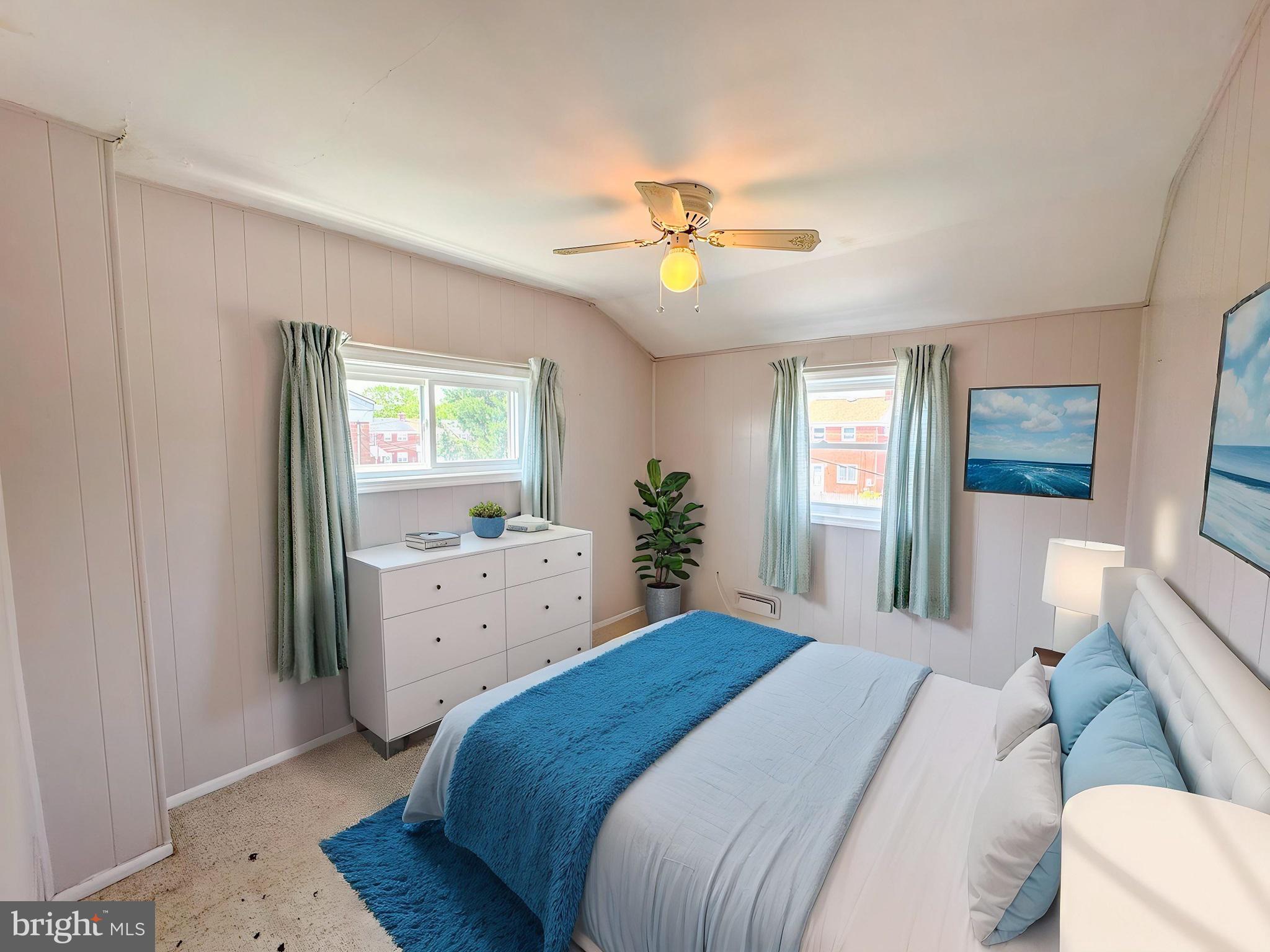 1948 Wareham Road Baltimore, MD 21222 - Photo 15 of 26 a bedroom with a large bed and a chandelier