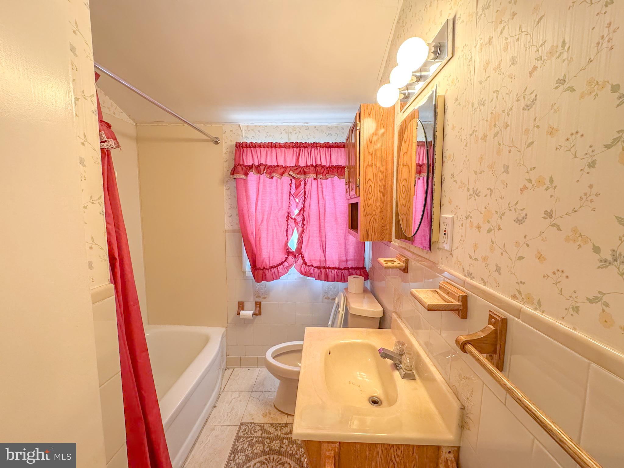 1948 Wareham Road Baltimore, MD 21222 - Photo 19 of 26 a bathroom with a sink a vanity and a mirror