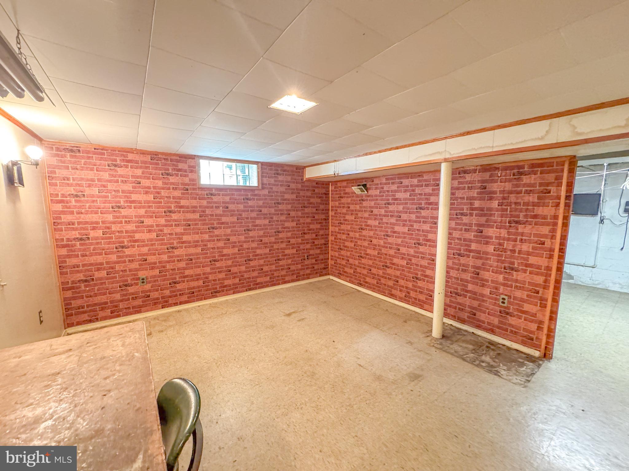 1948 Wareham Road Baltimore, MD 21222 - Photo 20 of 26 a view of an empty room with brick walls