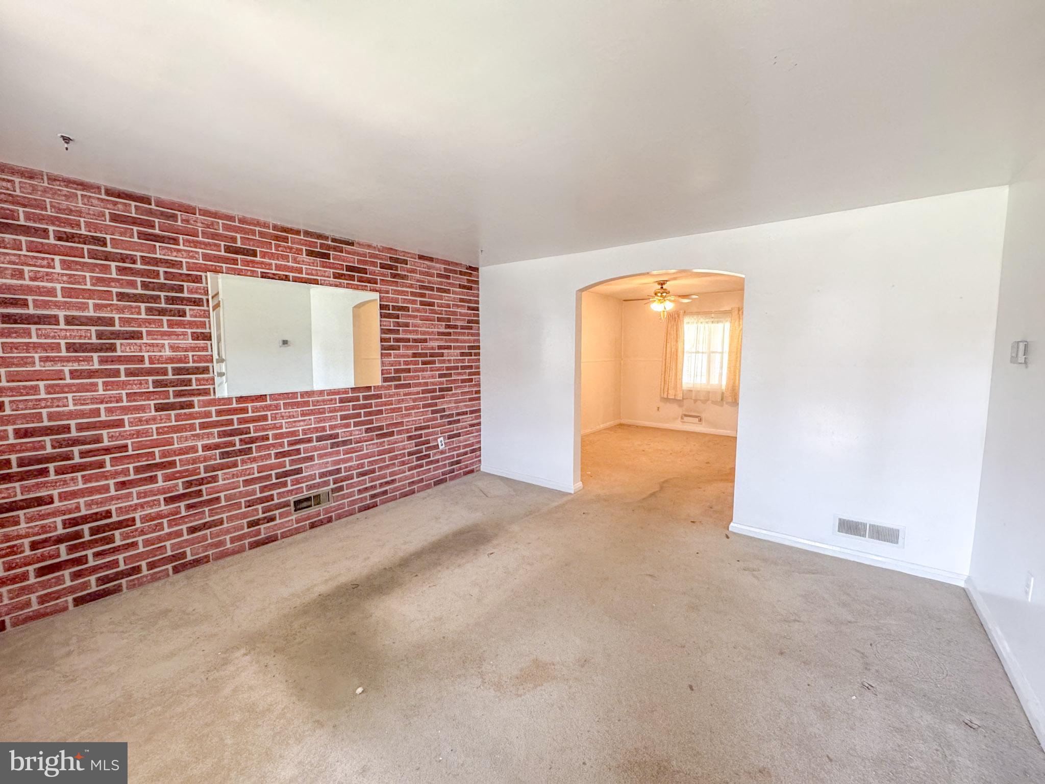1948 Wareham Road Baltimore, MD 21222 - Photo 5 of 26 a view of an empty room with a window