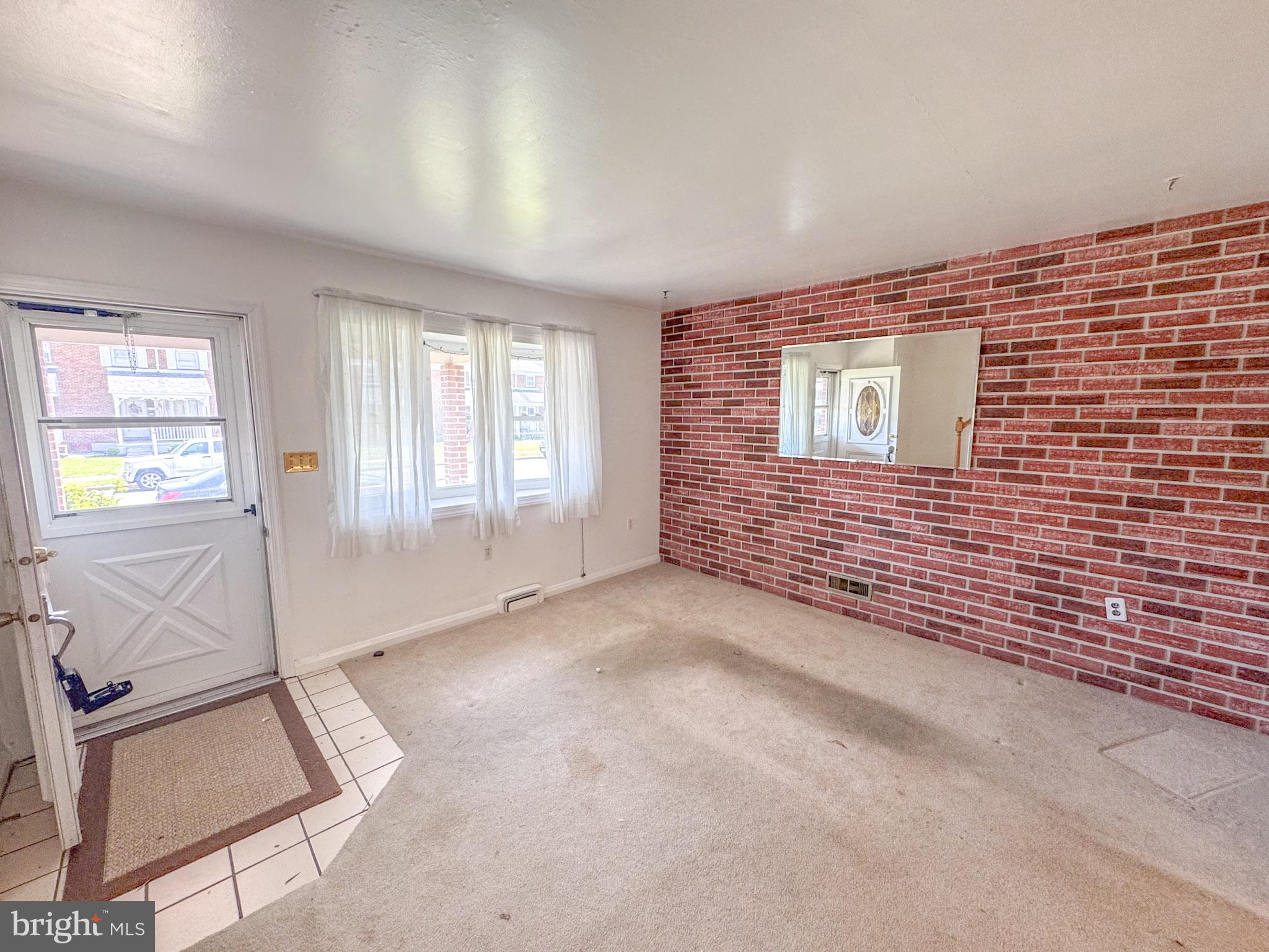 1948 Wareham Road Baltimore, MD 21222 - Photo 6 of 26 a view of an empty room with a window