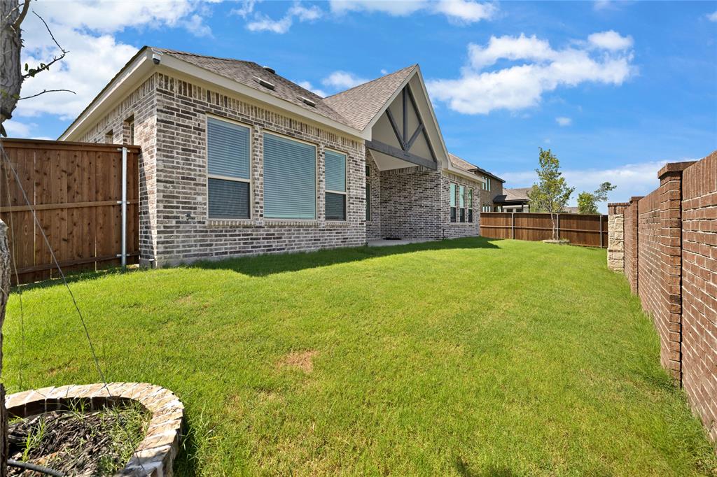 2307 Sam Street Mansfield, TX 76063 - Photo 20 of 23 View of side of property featuring brick siding, a fenced backyard, a patio, and roof with shingles