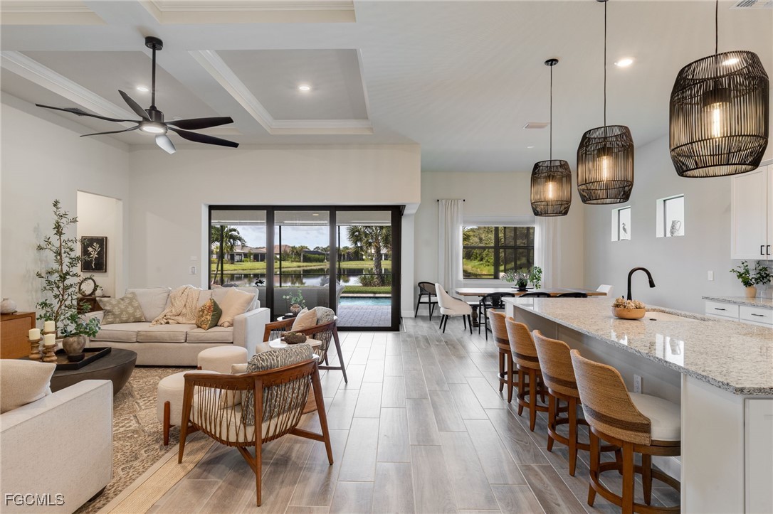 2937 Sagittaria Lane Alva, FL 33920 - Photo 13 of 50 a very nice looking dining room with wooden floor and chandelier