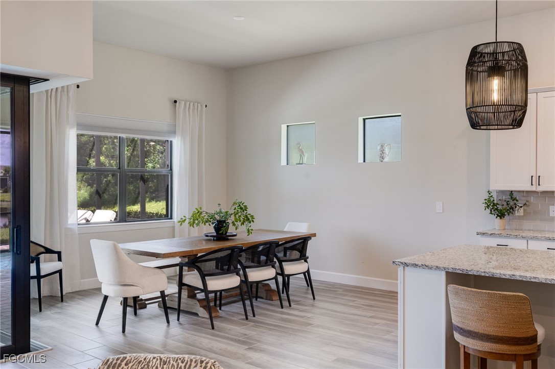 2937 Sagittaria Lane Alva, FL 33920 - Photo 18 of 50 a dining room with furniture and window
