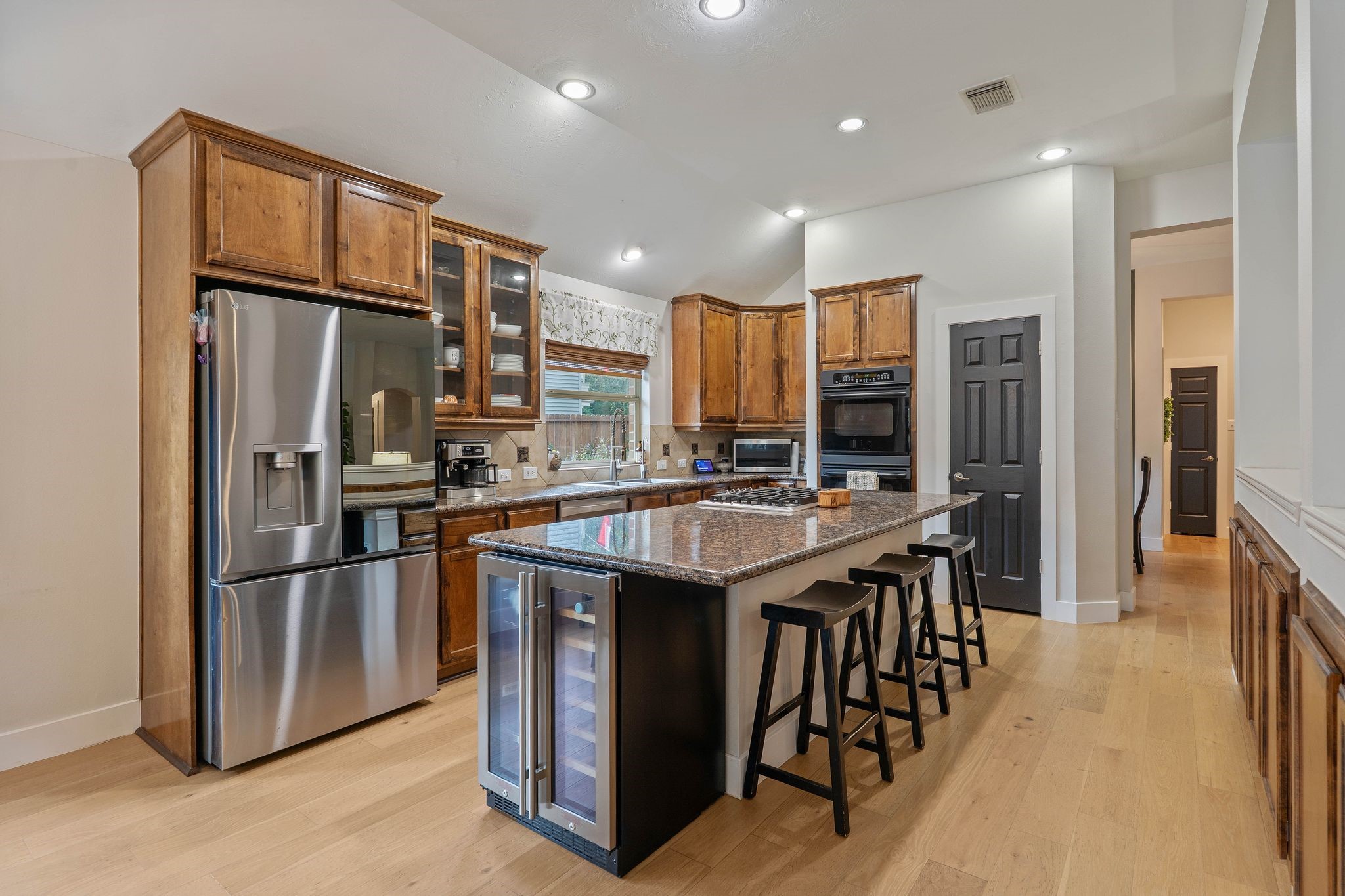 2408 Hollowbrook Lane Conroe, TX 77384 - Photo 13 of 49 Chef's dream kitchen with lots of granite counter space and open to the rest of the house.
