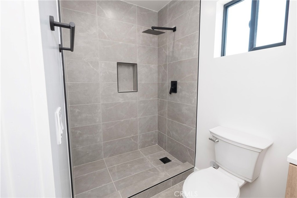 1571 Ricardo Street Los Angeles, CA 90033 - Photo 18 of 29 a bathroom with a shower and toilet