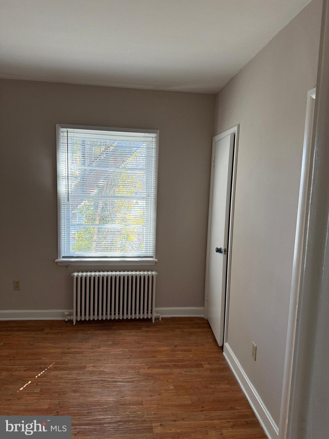 232 West Main Street, Unit 6 Waynesboro, PA 17268 - Photo 4 of 7 an empty room with wooden floor and windows