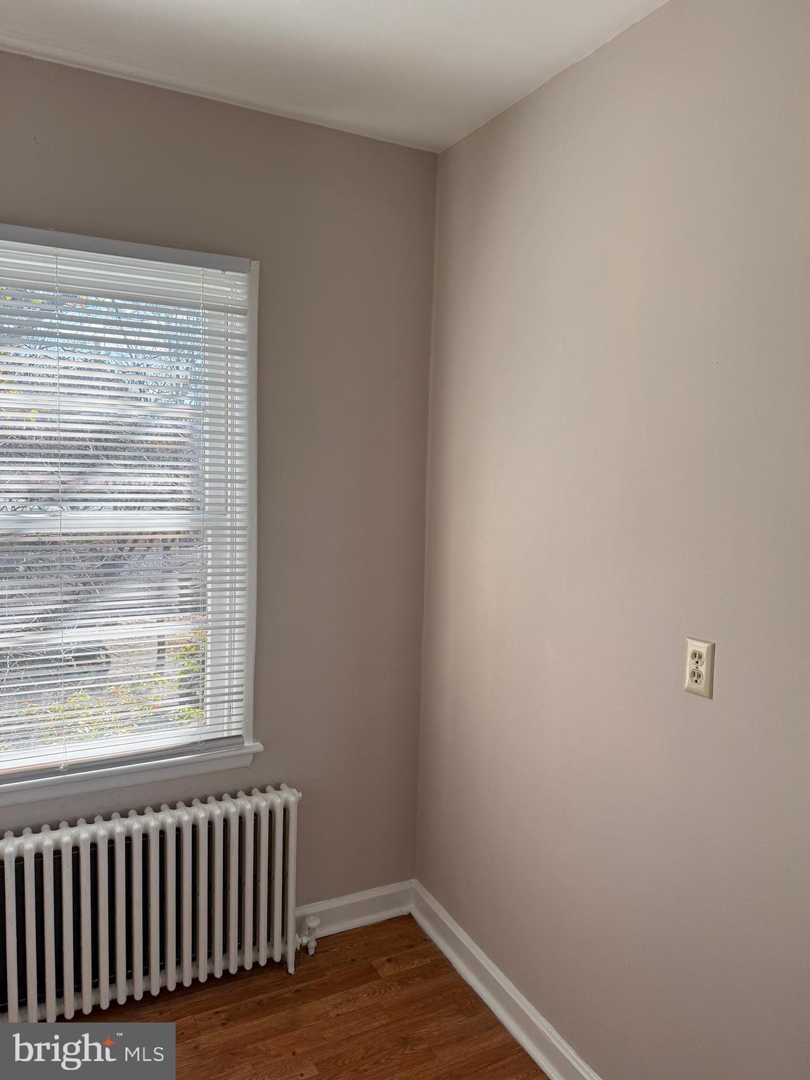 232 West Main Street, Unit 6 Waynesboro, PA 17268 - Photo 5 of 7 a view of an empty room with wooden floor and a window