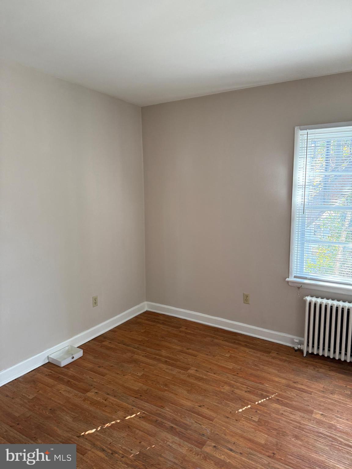 232 West Main Street, Unit 6 Waynesboro, PA 17268 - Photo 6 of 7 an empty room with wooden floor and windows