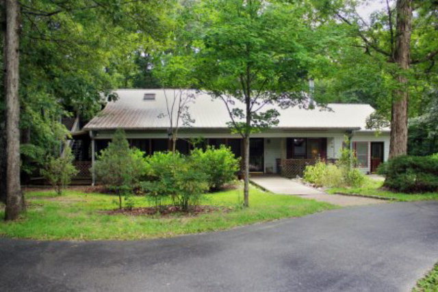85 Woods Road Juliette, GA 31046 - Photo 1 of 36 a front view of a house with a yard and porch