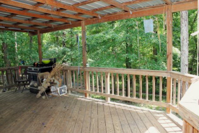 85 Woods Road Juliette, GA 31046 - Photo 11 of 36 a view of balcony with chairs and wooden fence