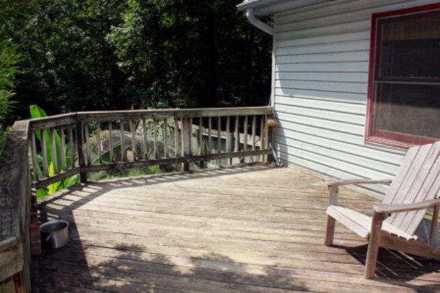 85 Woods Road Juliette, GA 31046 - Photo 12 of 36 a view of a balcony with two chairs and wooden fence