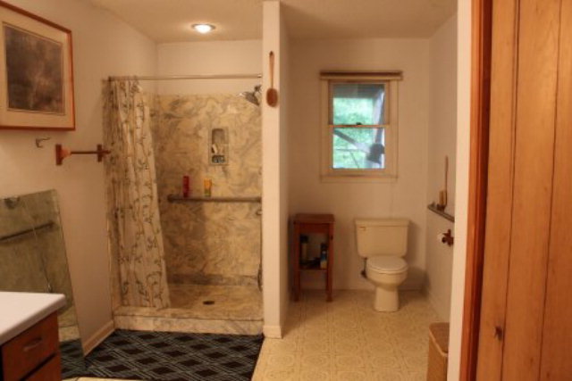 85 Woods Road Juliette, GA 31046 - Photo 16 of 36 a bathroom with a shower and a toilet