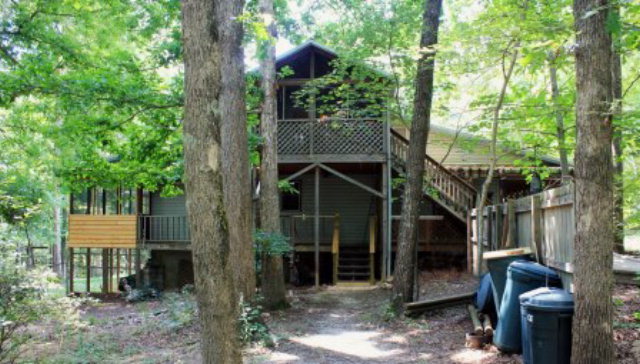 85 Woods Road Juliette, GA 31046 - Photo 27 of 36 a view of a house with backyard and a tree