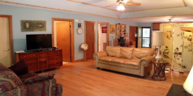 85 Woods Road Juliette, GA 31046 - Photo 4 of 36 a living room with furniture and a flat screen tv