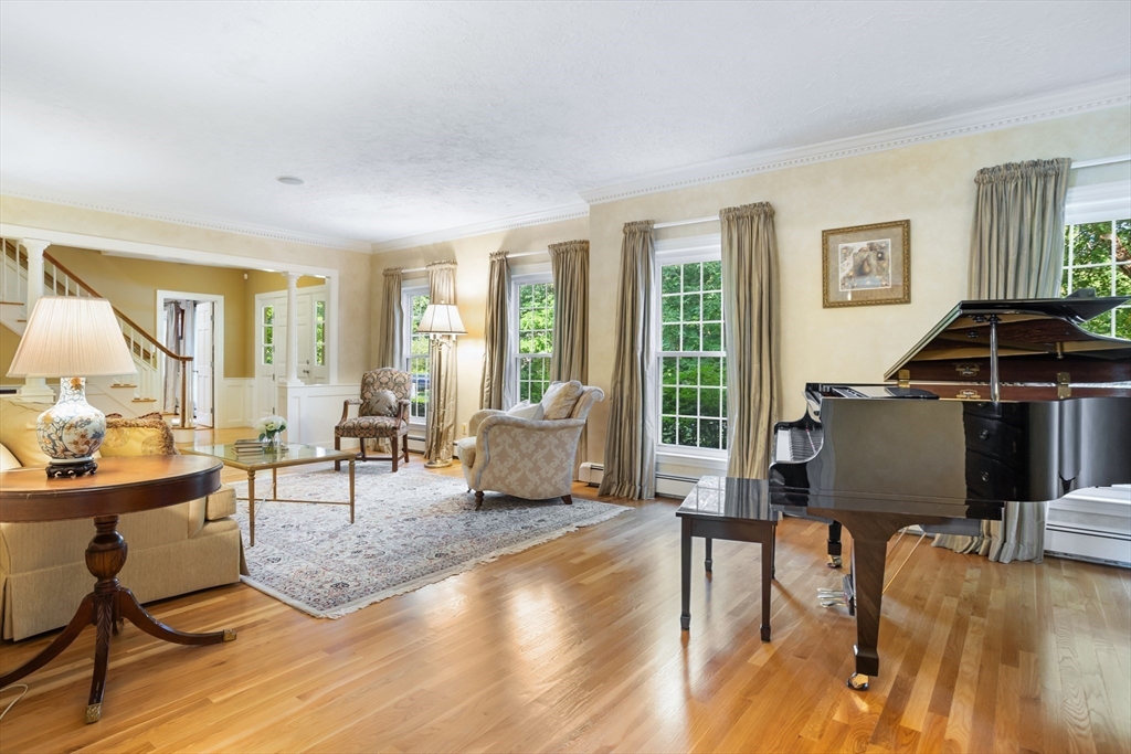 21 Grasshopper Lane Acton, MA 01720 - Photo 11 of 38 a living room with furniture and a large window