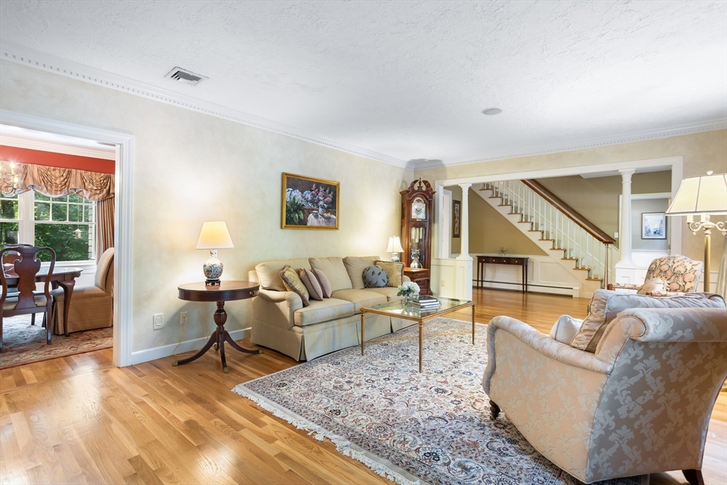 21 Grasshopper Lane Acton, MA 01720 - Photo 12 of 38 a living room with furniture and a rug