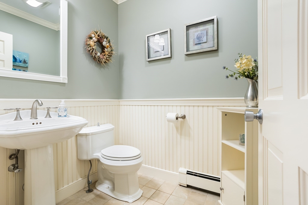21 Grasshopper Lane Acton, MA 01720 - Photo 17 of 38 a bathroom with a sink mirror vanity and toilet
