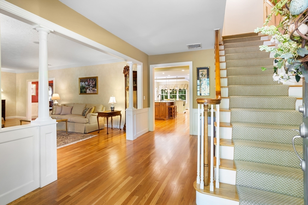 21 Grasshopper Lane Acton, MA 01720 - Photo 18 of 38 a living room with furniture and a wooden floor