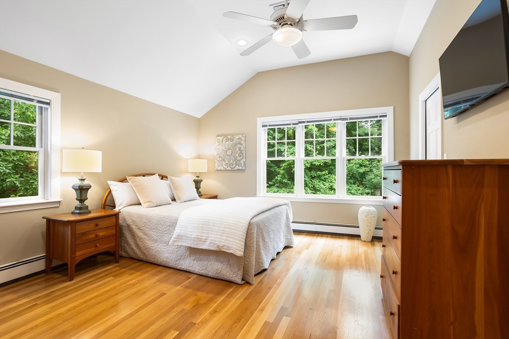 21 Grasshopper Lane Acton, MA 01720 - Photo 19 of 38 a bedroom with a large bed and a large window