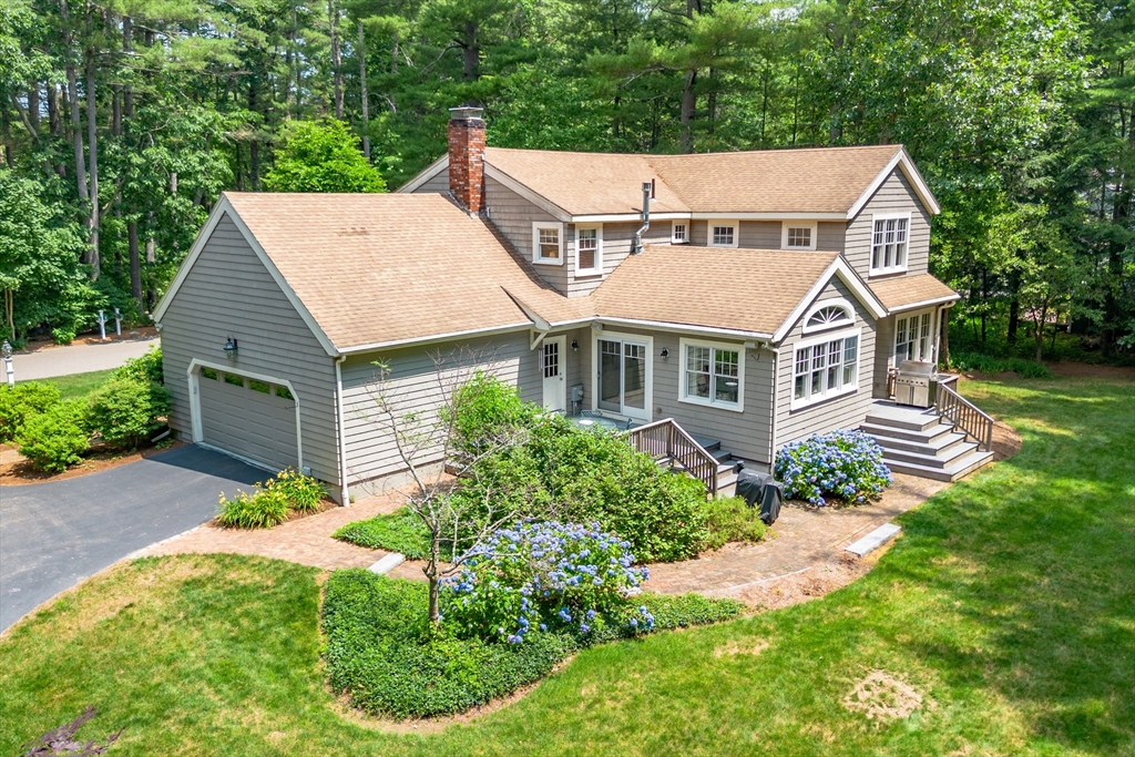 21 Grasshopper Lane Acton, MA 01720 - Photo 2 of 38 an aerial view of a house with yard and green space