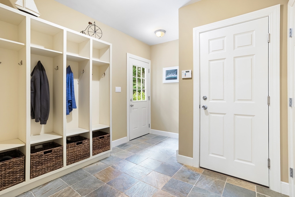 21 Grasshopper Lane Acton, MA 01720 - Photo 27 of 38 an entryway with a walk in closet