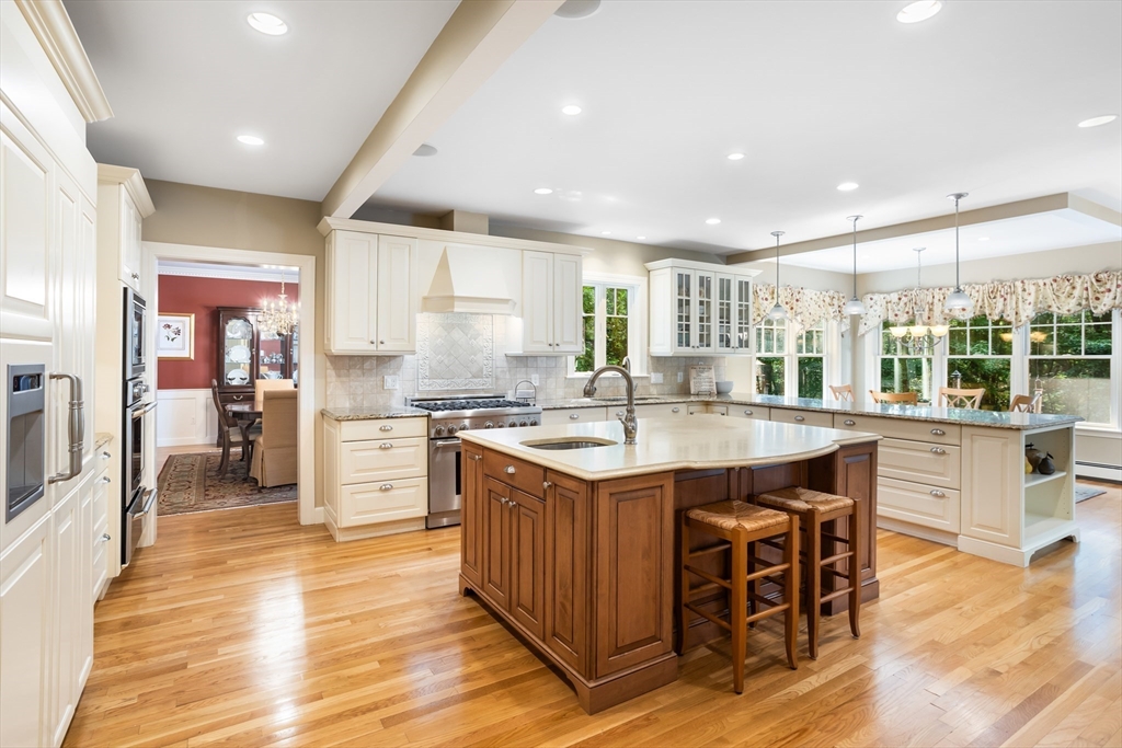 21 Grasshopper Lane Acton, MA 01720 - Photo 3 of 38 a kitchen with stainless steel appliances granite countertop counter space a sink and a refrigerator