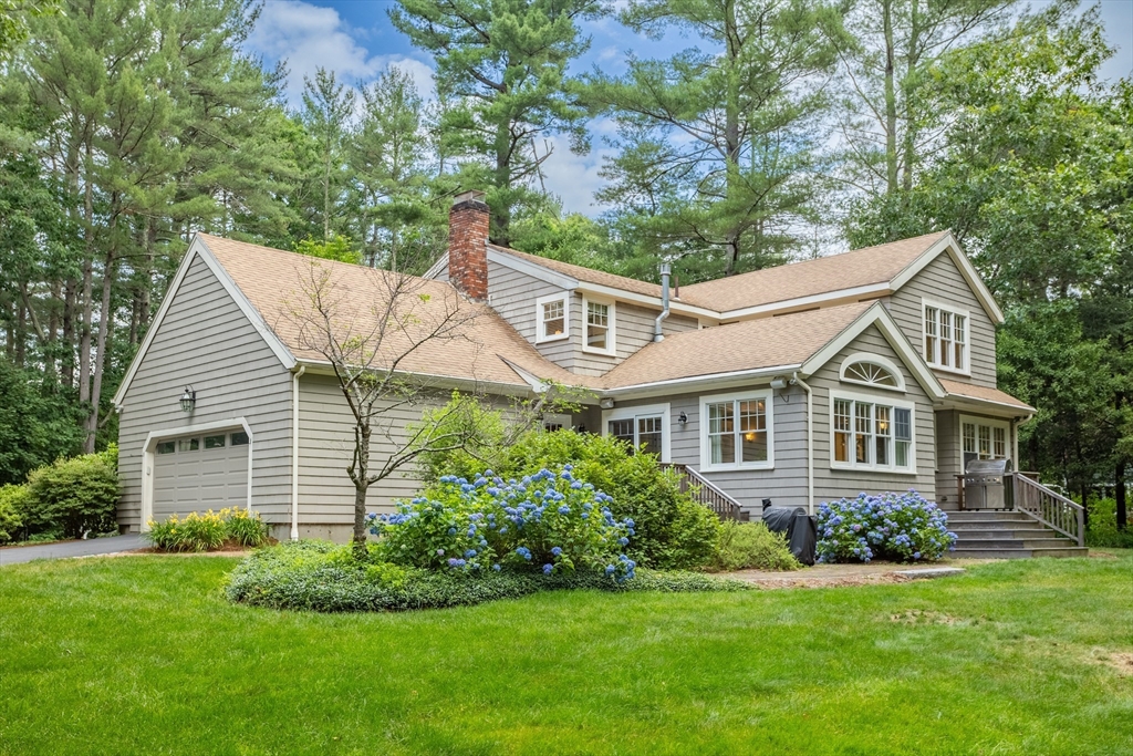 21 Grasshopper Lane Acton, MA 01720 - Photo 32 of 38 front view of a house with a yard