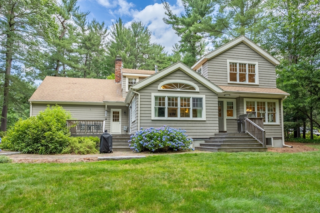 21 Grasshopper Lane Acton, MA 01720 - Photo 34 of 38 a front view of a house with a yard