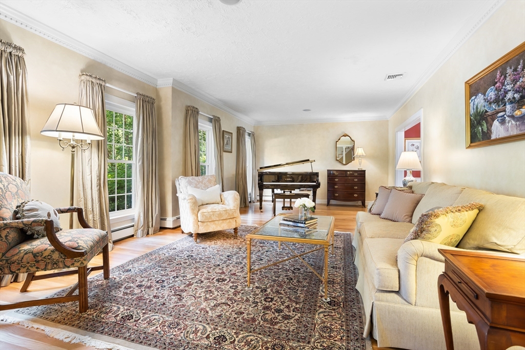 21 Grasshopper Lane Acton, MA 01720 - Photo 5 of 38 a living room with furniture and a table