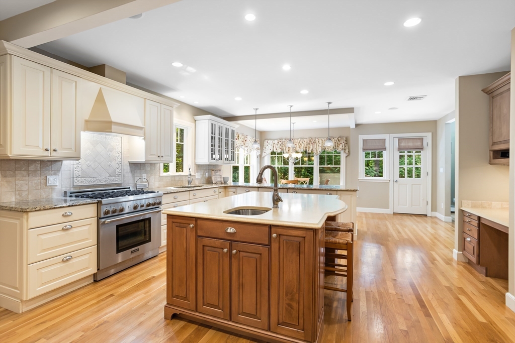 21 Grasshopper Lane Acton, MA 01720 - Photo 6 of 38 a kitchen with stainless steel appliances granite countertop a stove and a sink