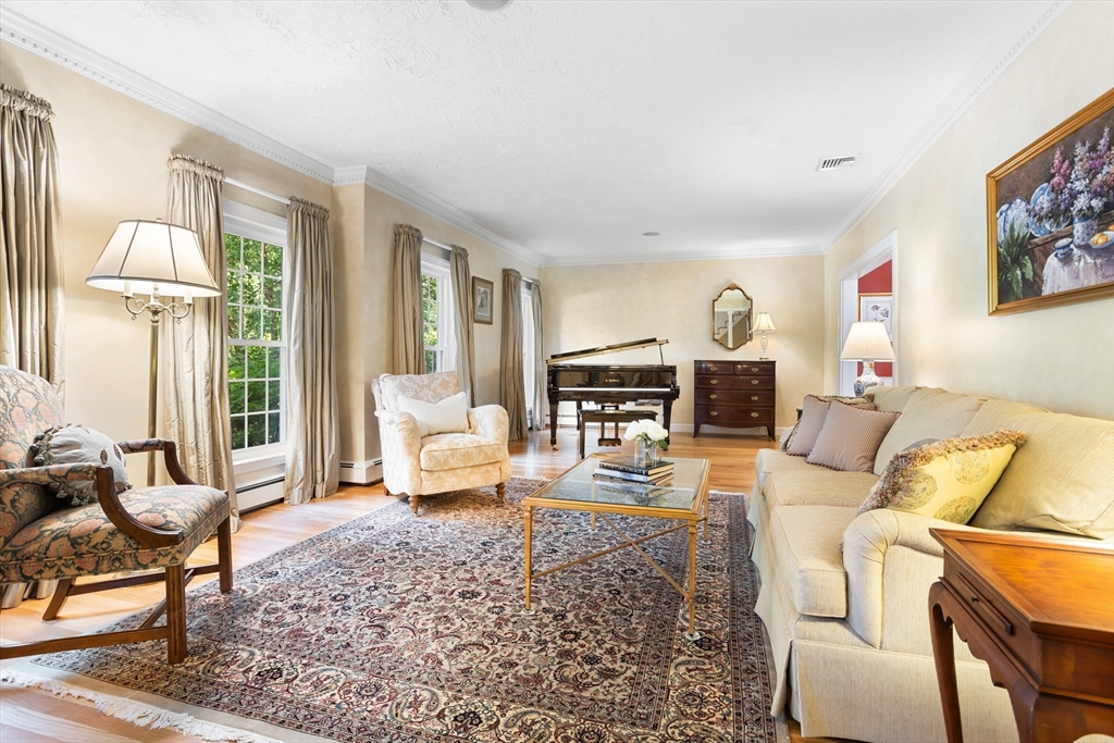 21 Grasshopper Lane Acton, MA 01720 - Photo 10 of 38 a living room with furniture and a table
