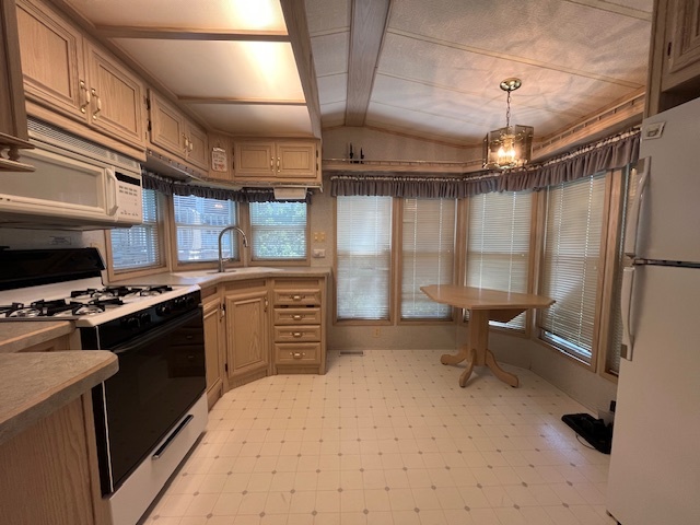 2795 East 28th Road Marseilles, IL 61341 - Photo 6 of 65 a kitchen with stainless steel appliances a stove a sink and a refrigerator