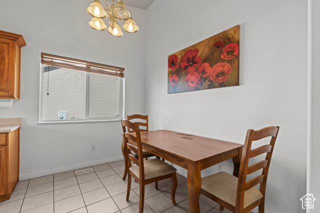 1099 Three Point Avenue Logan, UT 84321 - Photo 7 of 27 Dining room with a chandelier and light tile patterned floors