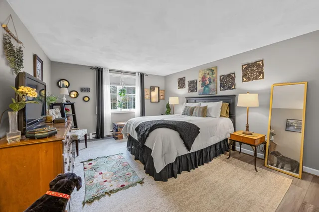 a bedroom with a bed and a desk