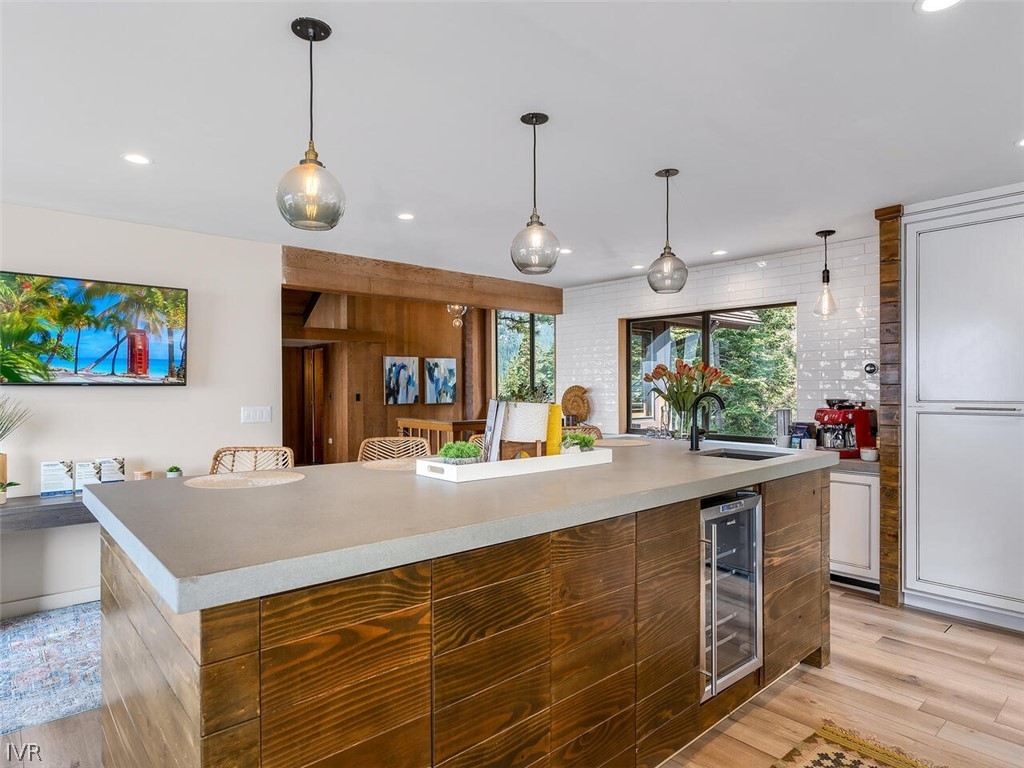 751 Champagne Road Incline Village, NV 89451 - Photo 11 of 30 a large kitchen with stainless steel appliances granite countertop a sink a oven and a refrigerator