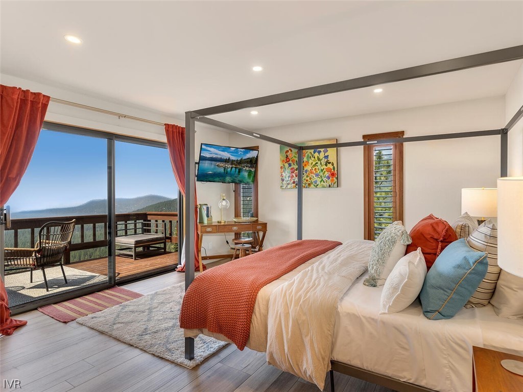 751 Champagne Road Incline Village, NV 89451 - Photo 14 of 30 a bedroom with a bed and large window