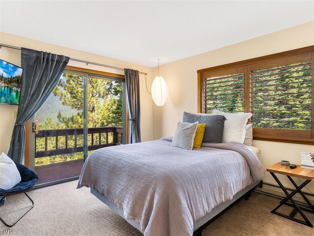 751 Champagne Road Incline Village, NV 89451 - Photo 19 of 30 a bed sitting in a bedroom next to a window