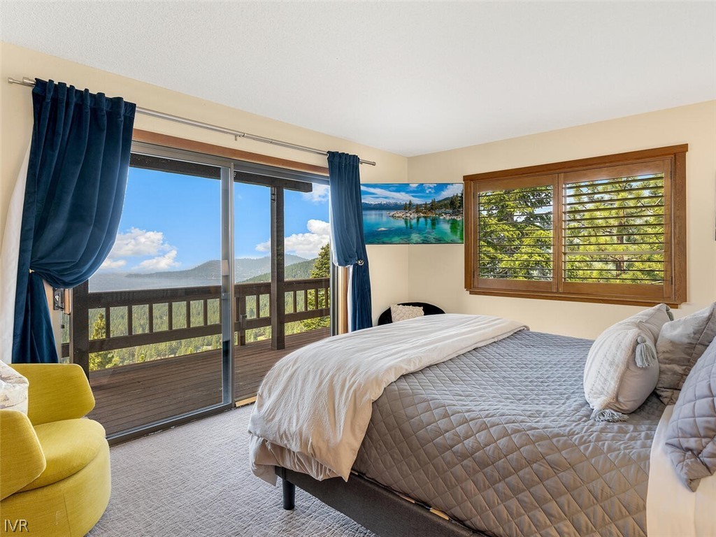 751 Champagne Road Incline Village, NV 89451 - Photo 20 of 30 a bedroom with a bed and glass window