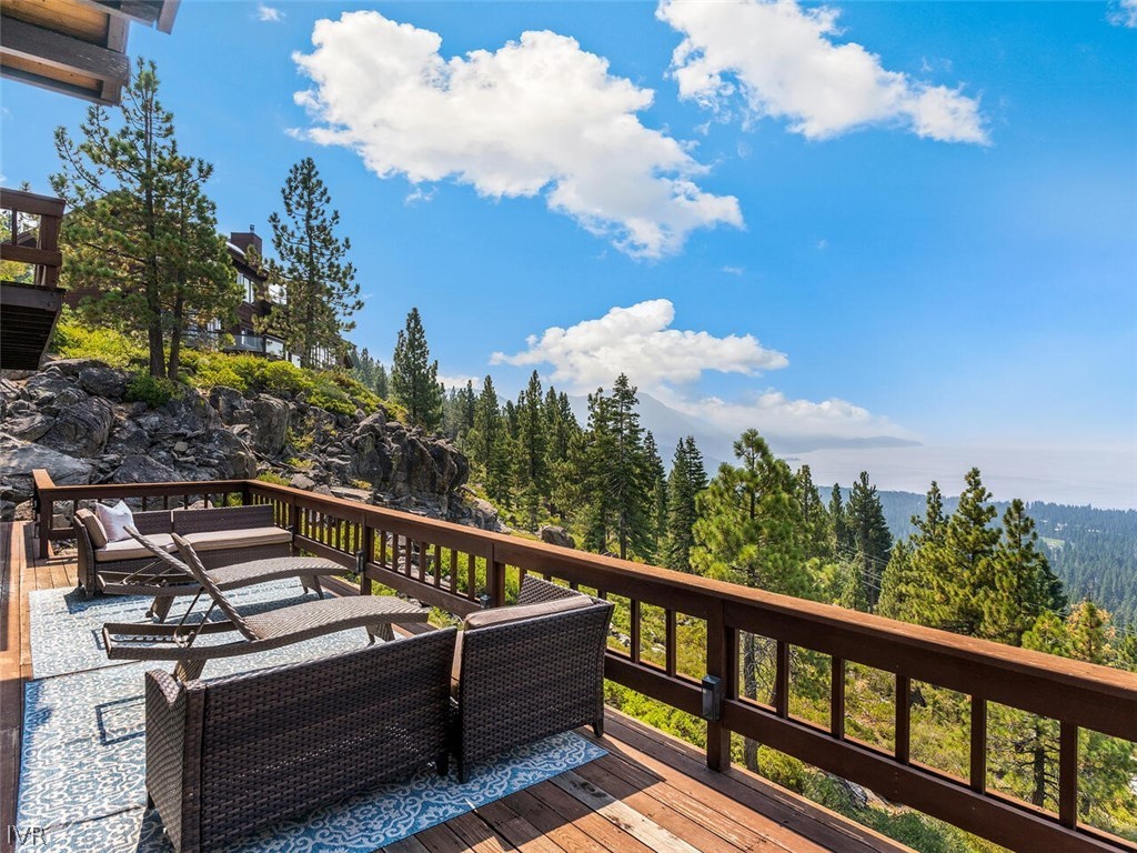 751 Champagne Road Incline Village, NV 89451 - Photo 24 of 30 a view of a balcony with wooden floor and fence
