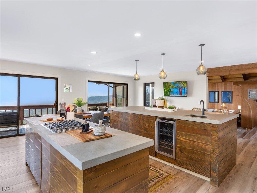 751 Champagne Road Incline Village, NV 89451 - Photo 9 of 30 a kitchen with kitchen island a sink stove and wooden floor